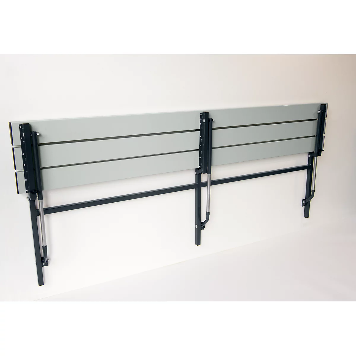 Gray wall bench against white background. Black metal frame. Folding mechanism.