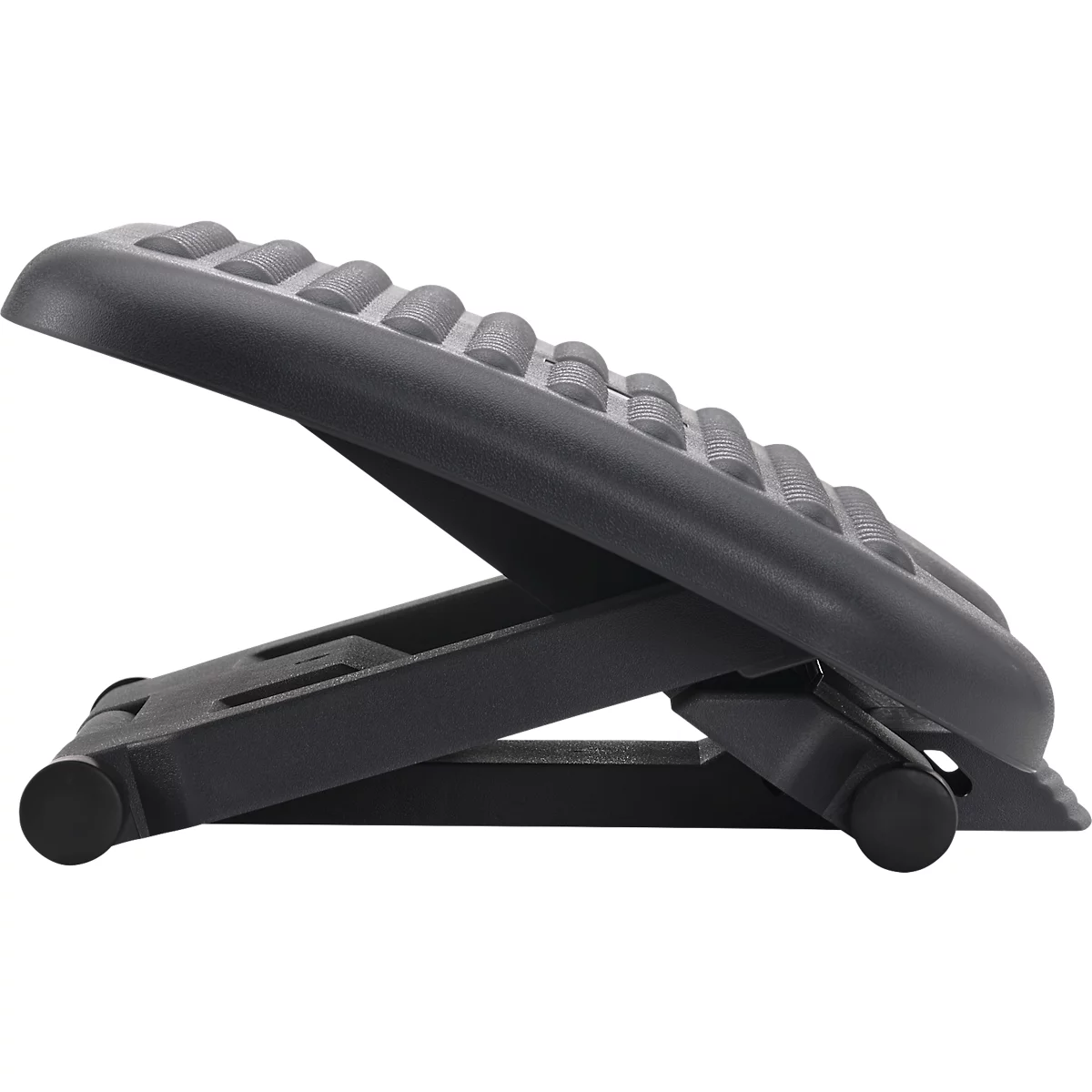 Black plastic footrest, ribbed surface. Adjustable in angle.