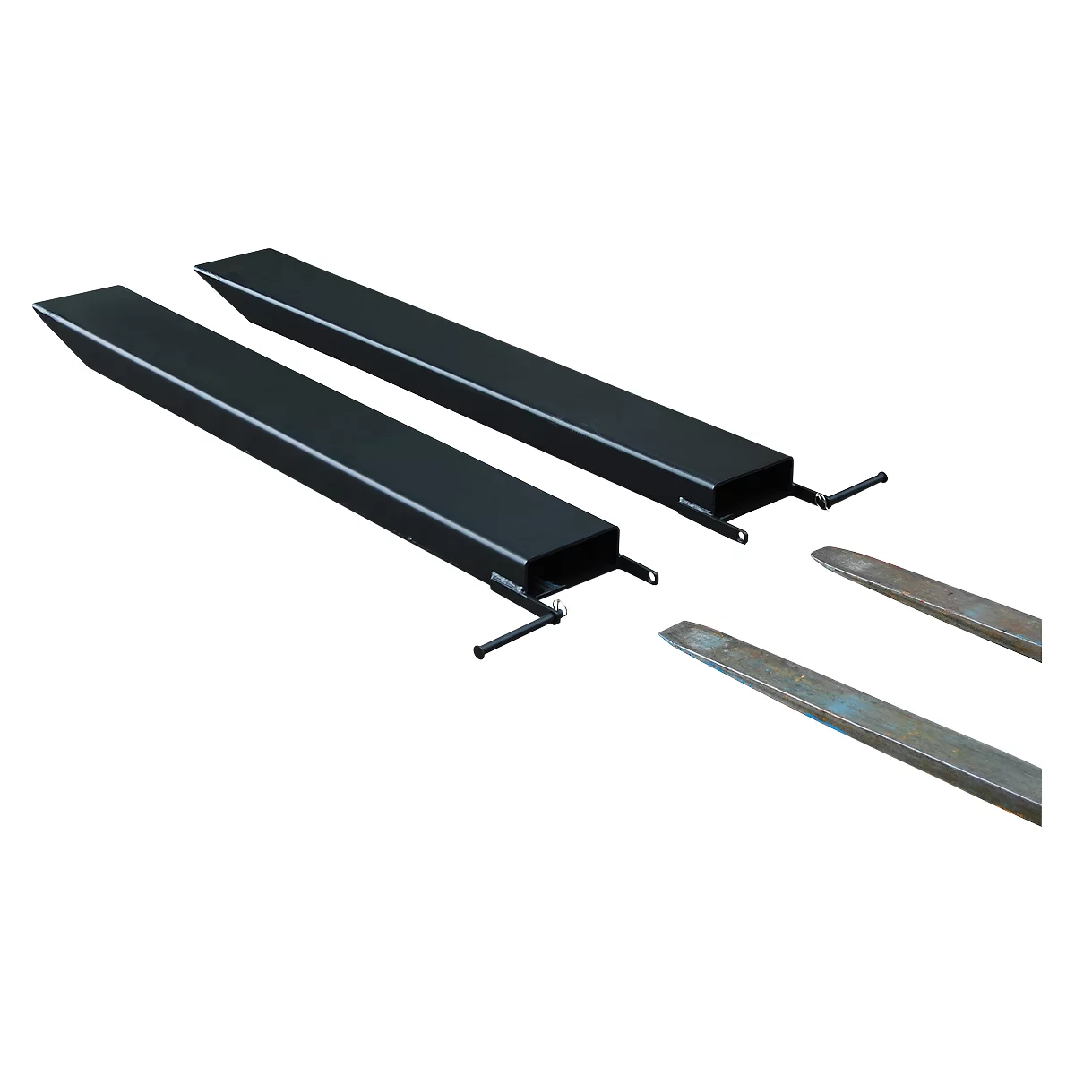 Two forklift forks, dark gray, lie on a white surface. Two metal tips are in the foreground.