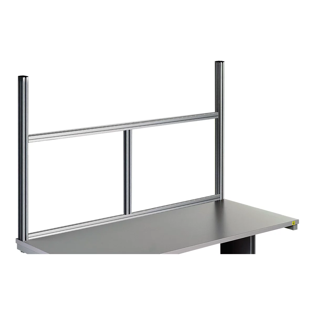 Gray metal construction with vertical and horizontal bars. Mounted on a gray table, presumably as protection.