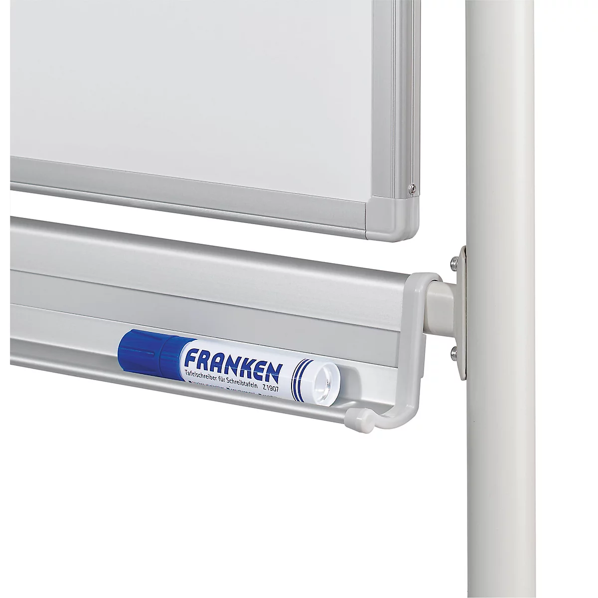 Close-up of a whiteboard with a blue Franken marker. The marker is lying in a tray.