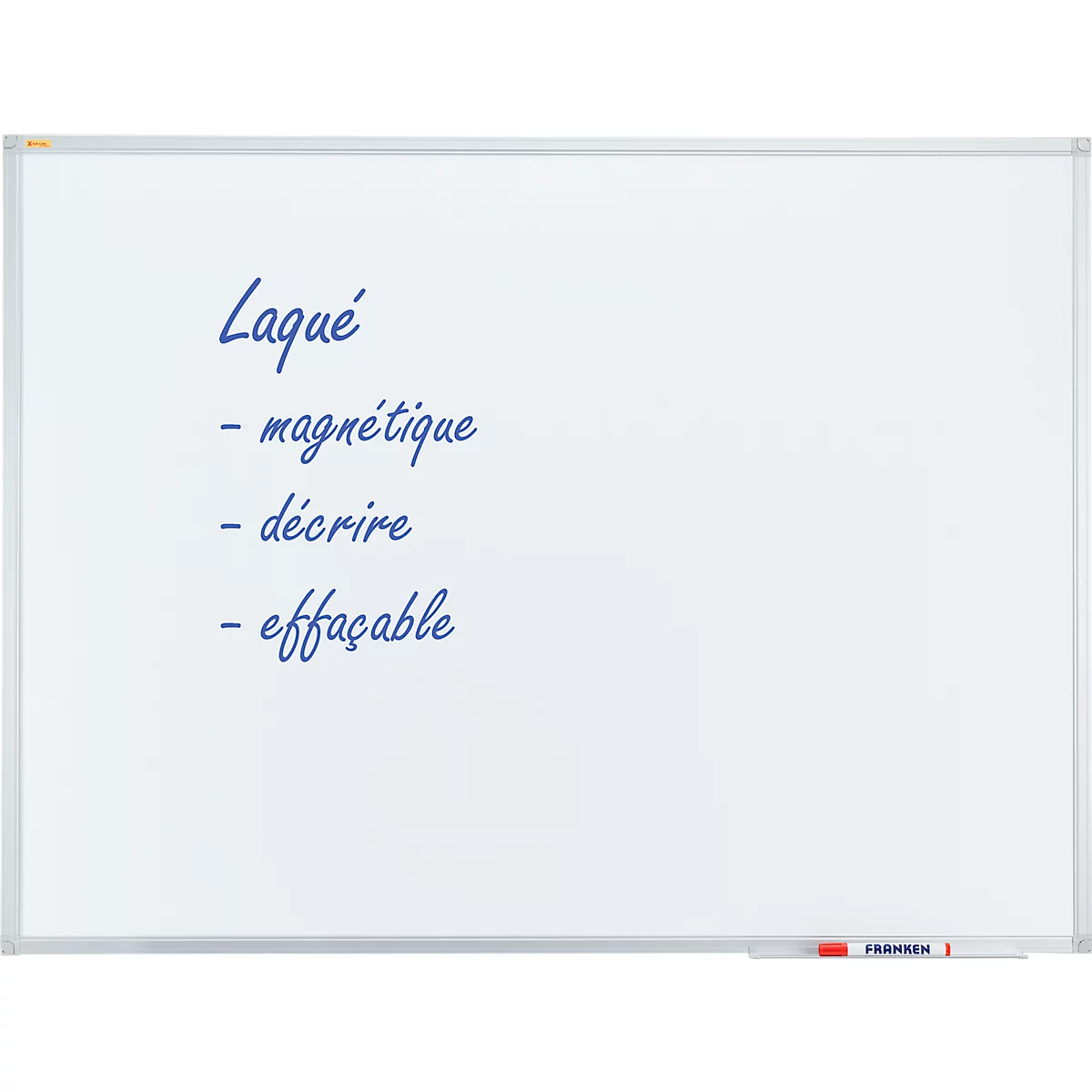 White, rectangular whiteboard with dark blue lettering. Text: 'Laqué - magnétique - décrire - effaçable'.