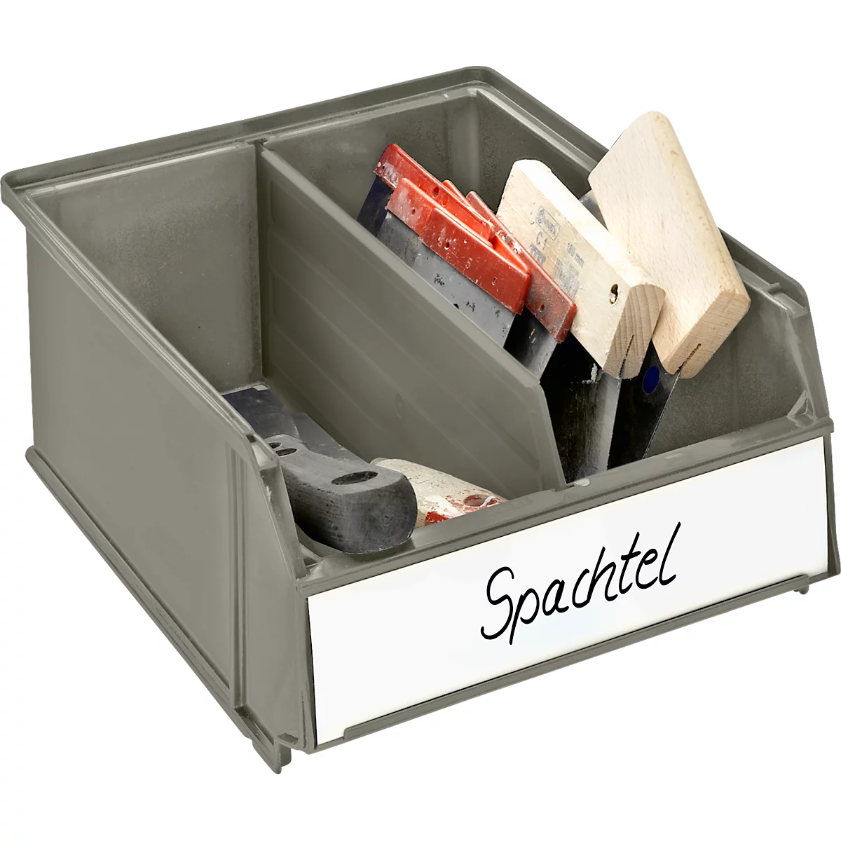 Grey toolbox with spatulas and wooden blocks. White sign with black writing says "Spatula".