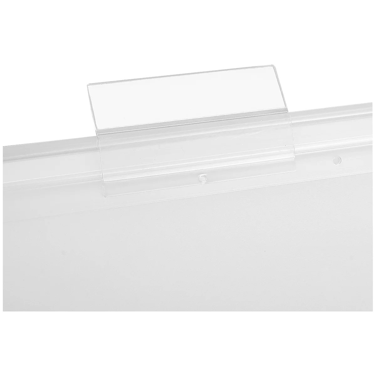 Transparent plastic holder attached to a white surface, close up.