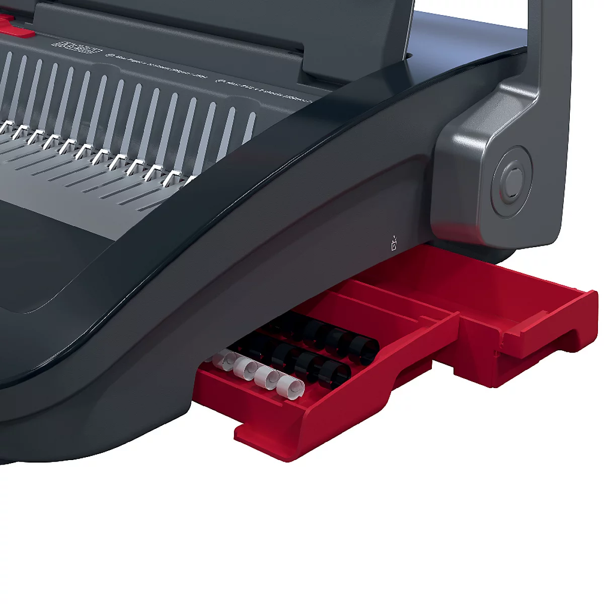 Detailopname van een zwarte en grijze bindmachine met een rode lade. In de lade liggen diverse bindringen.