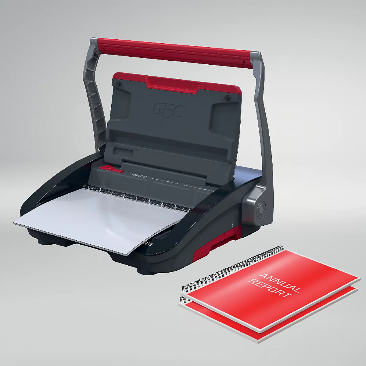 Zwart bindapparaat met rode handgreep, daarnaast een rood boekje met de woorden "Annual Report".