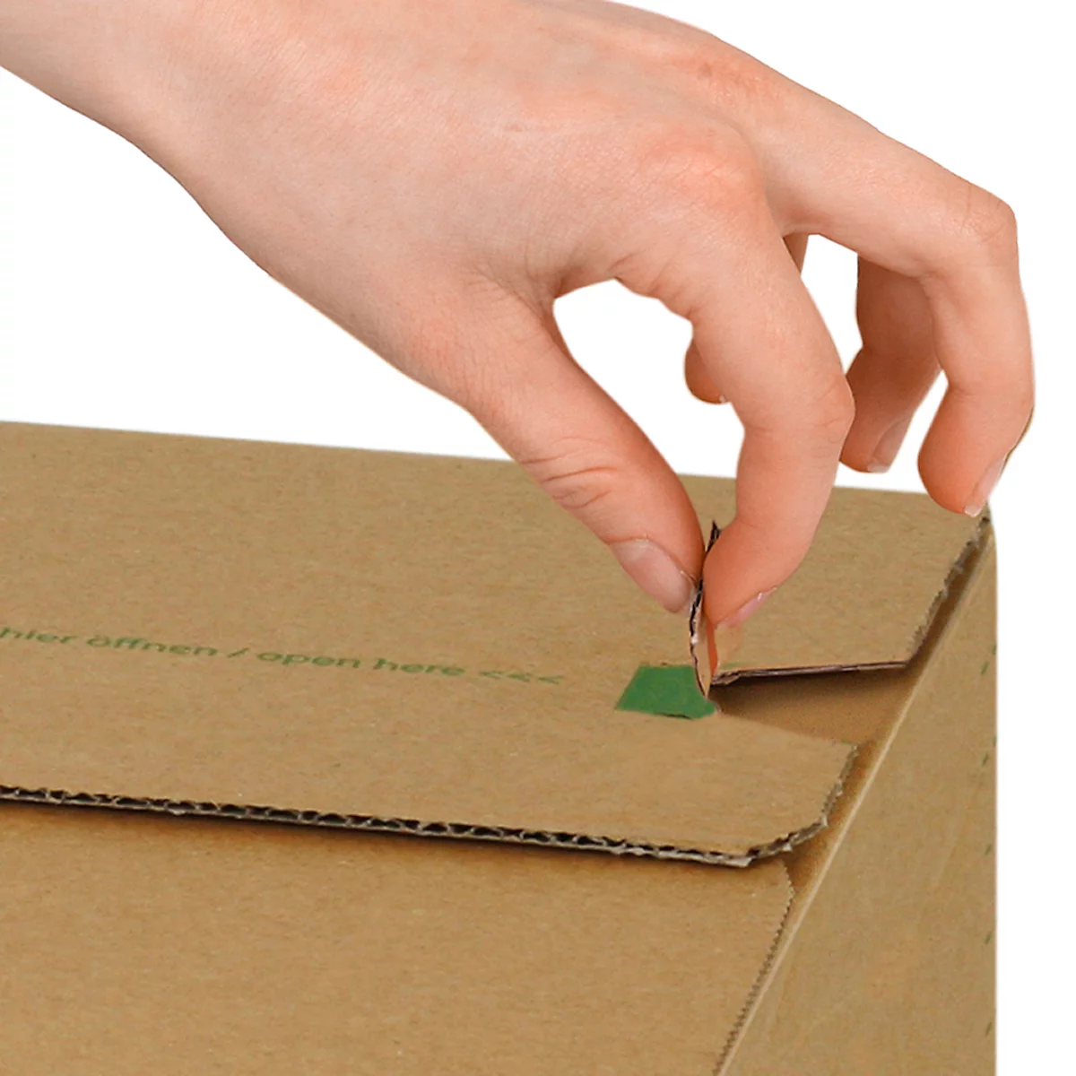 A hand opens a cardboard box by pulling on a small metal tab.
