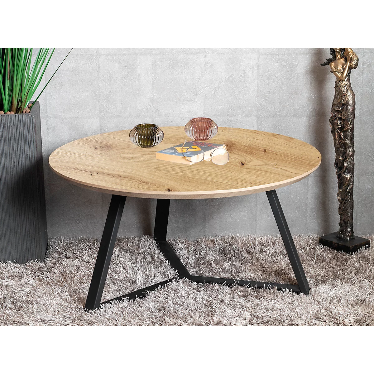 Table basse ronde avec un plateau en bois et une structure en métal noir.
