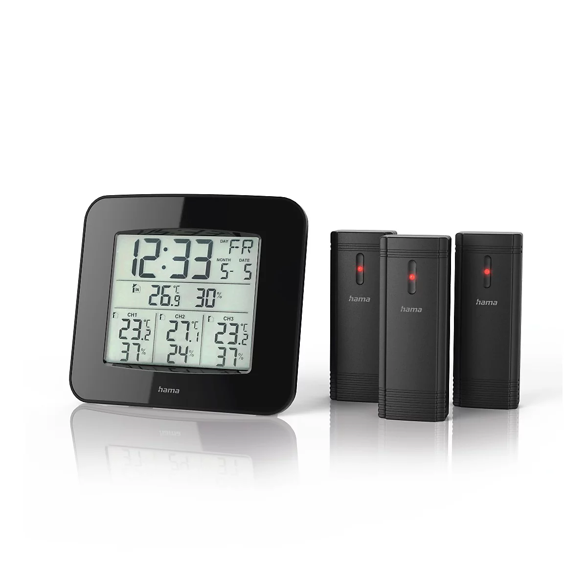 Schwarze Wetterstation mit Digitalanzeige und drei kleinen Sendern. Die Anzeige zeigt Uhrzeit, Datum und Temperatur.