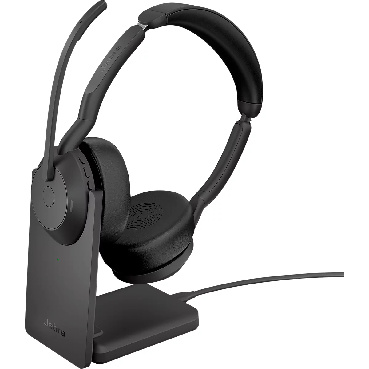 Black headset with charging dock, close-up shot. The headset is connected, with microphone and logos visible.