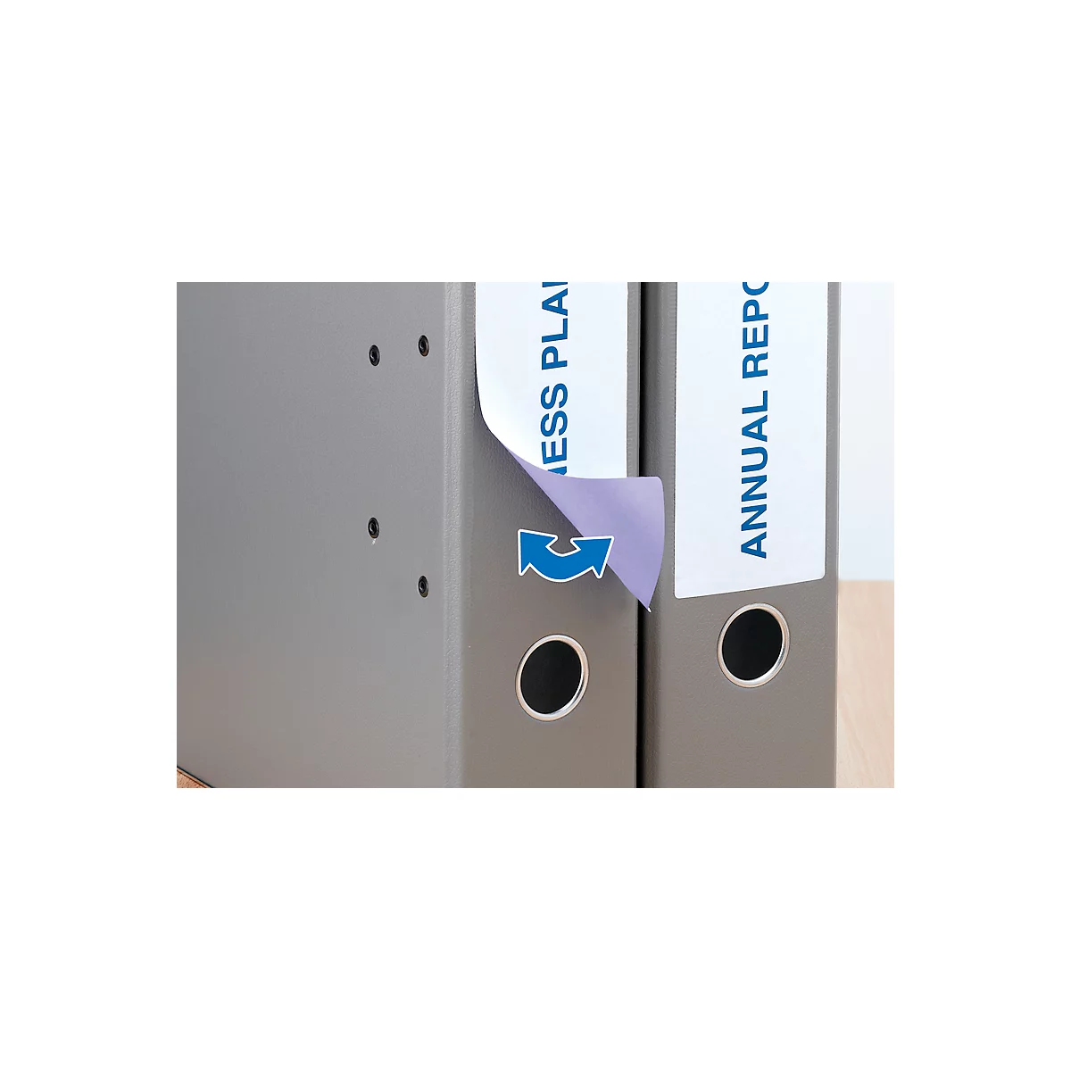 Gray folders stand side by side. One is labeled "Business Plan", the other "Annual Report". An arrow symbol is displayed on a folder.