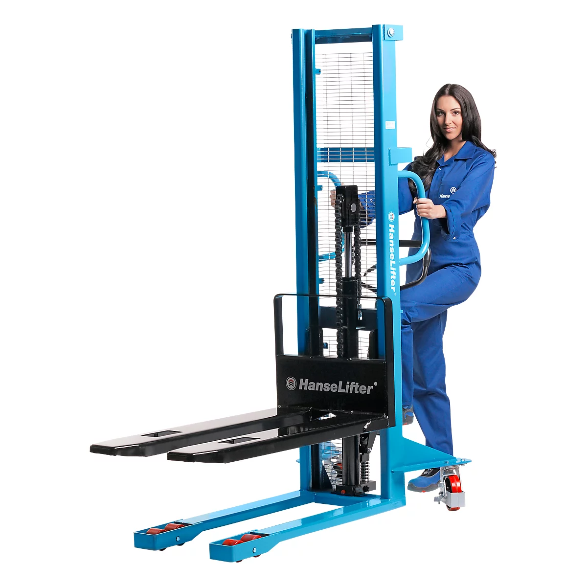 A woman stands next to a blue forklift and holds onto the handle.