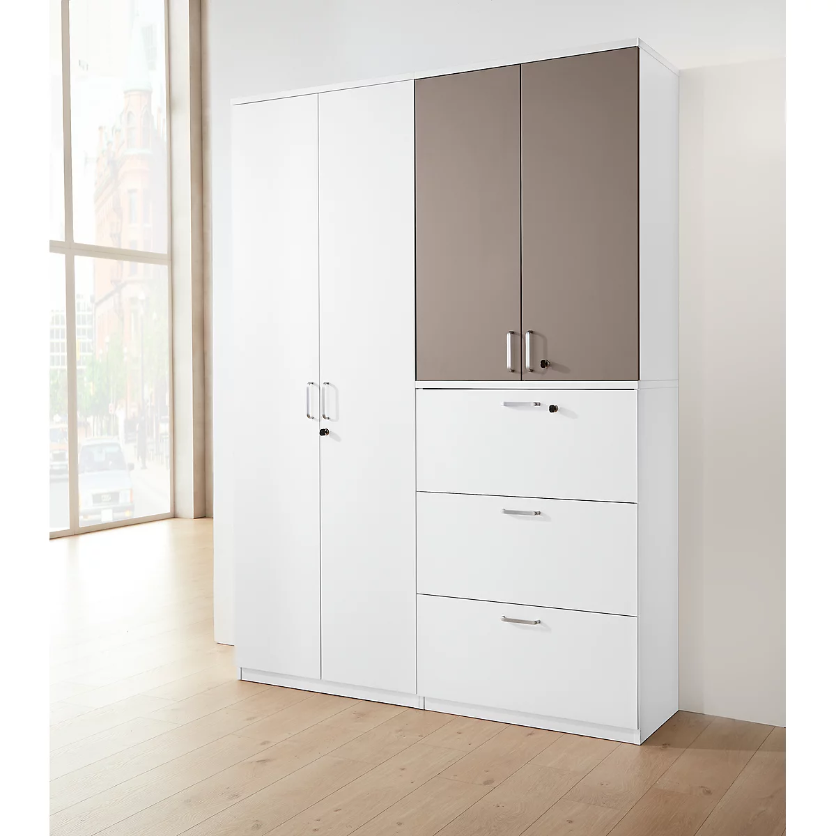 White office cabinet, partly with brown doors, drawers and cabinet doors. Wooden floor in front, window on the right.