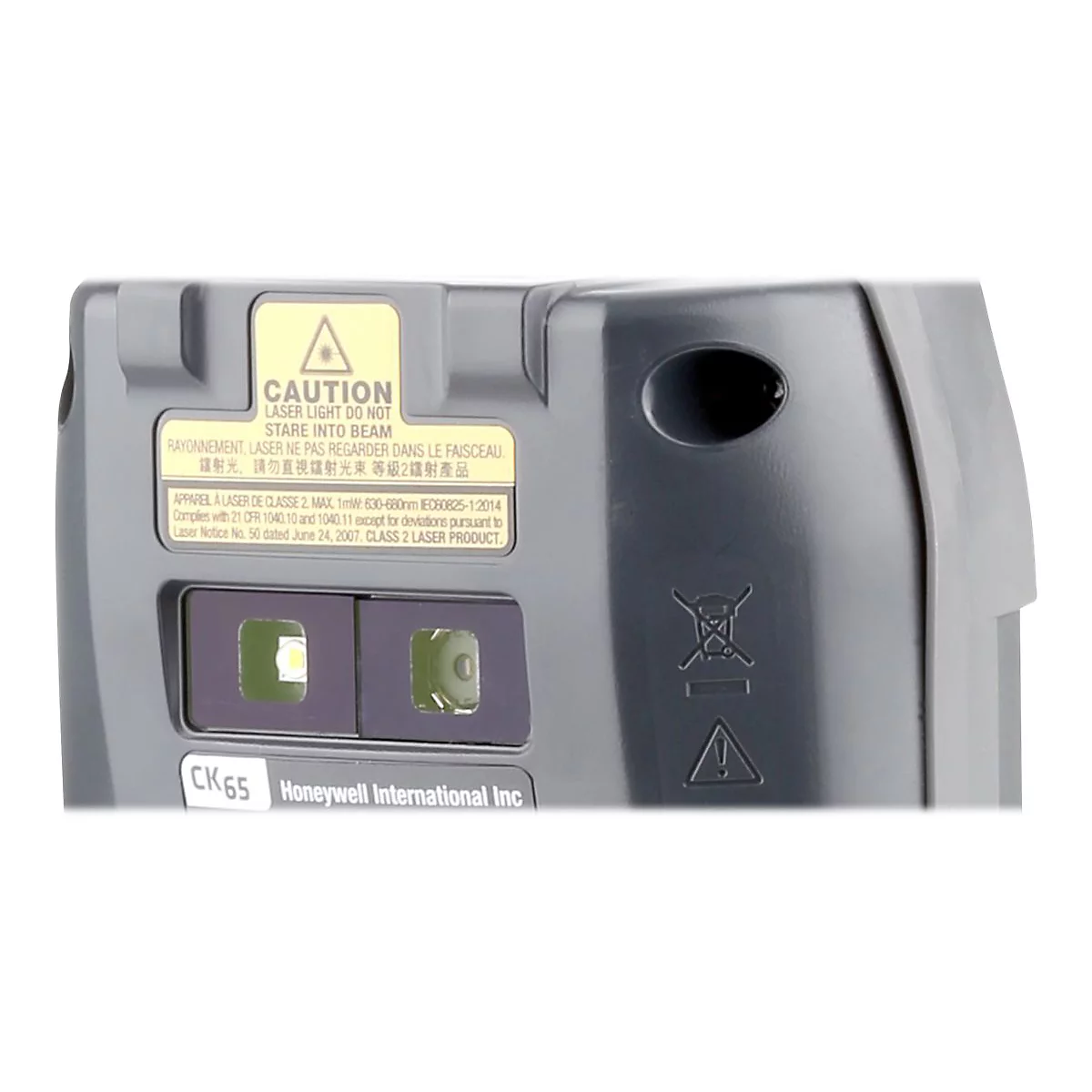 Detailaufnahme eines grauen GerÃ¤ts mit gelbem Warnhinweis: 'CAUTION LASER LIGHT DO NOT STARE INTO BEAM'. Darunter die SchriftzÃ¼ge 'CK65' und 'Honeywell International Inc'.