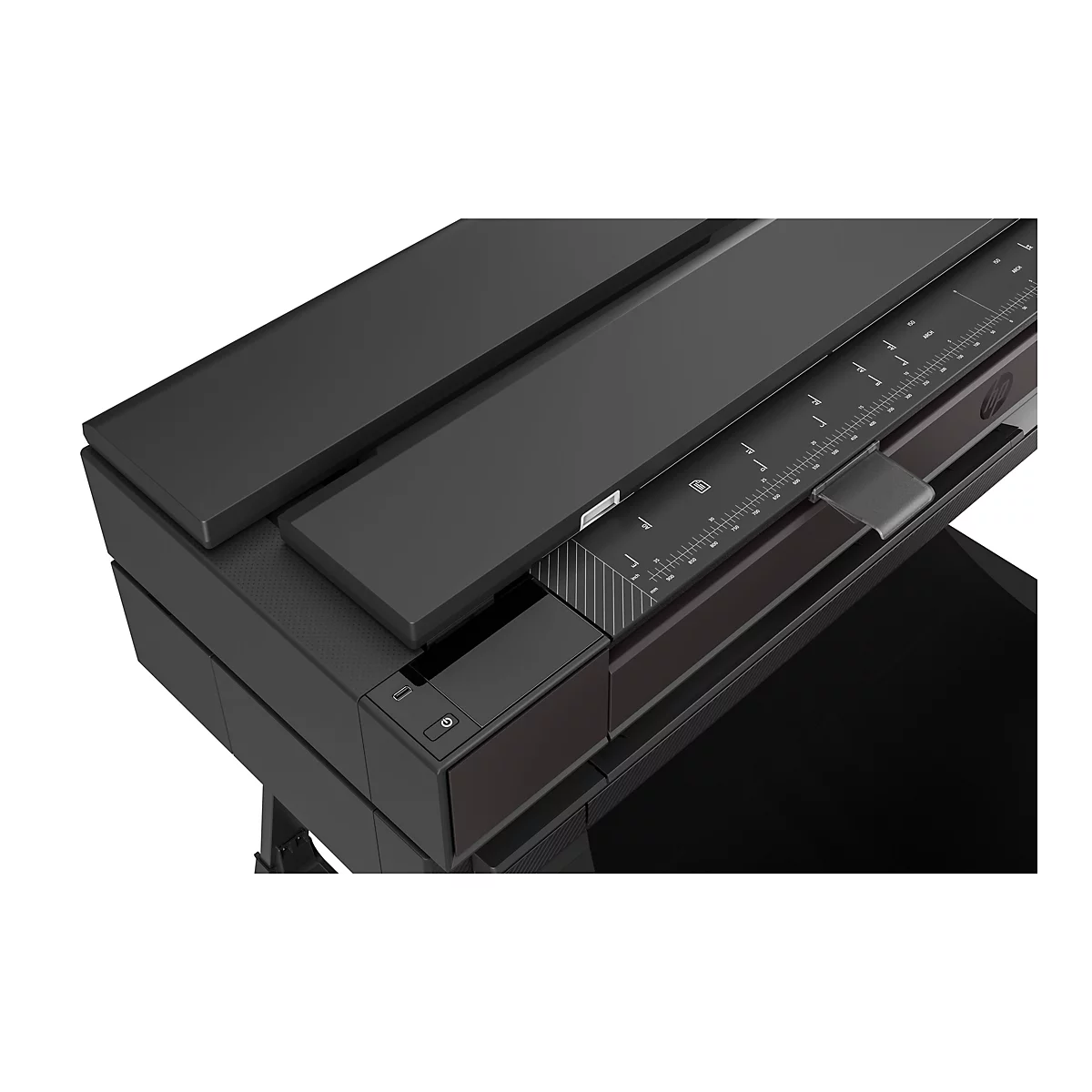 Gros plan d'une imprimante grand format noire avec échelle de mesure et commandes.