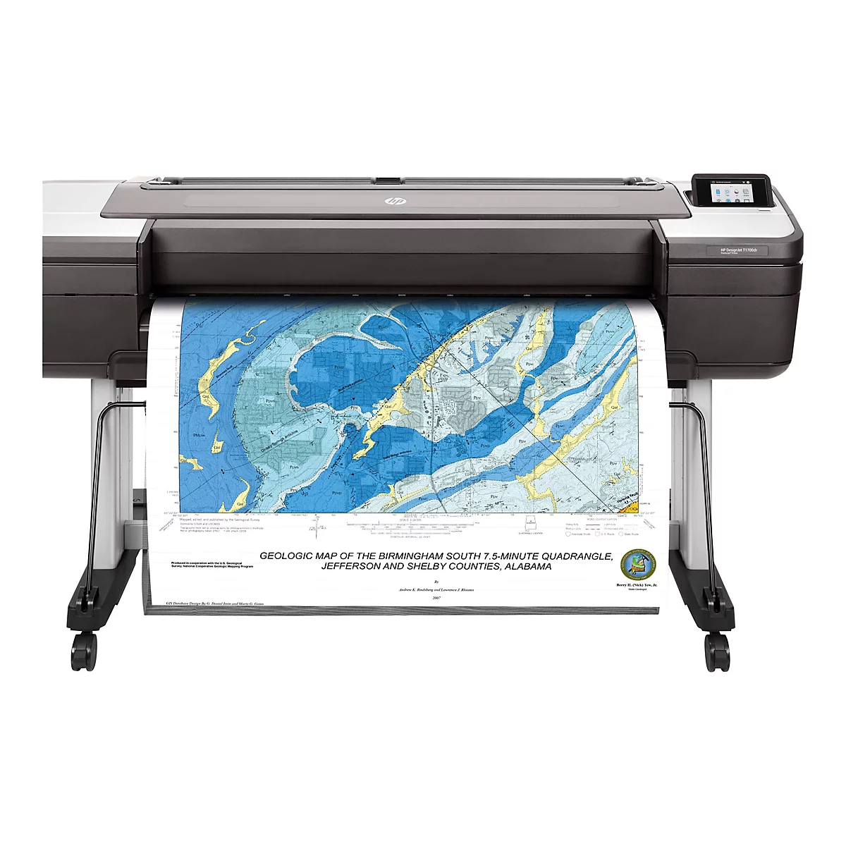 Ein großer, dunkler HP DesignJet T1700dr Drucker druckt eine detaillierte geologische Karte der Birmingham South Gegend, Alabama. Die Karte zeigt verschiedene geologische Formationen in Blau, Gelb und Grün mit Textmarkierungen.