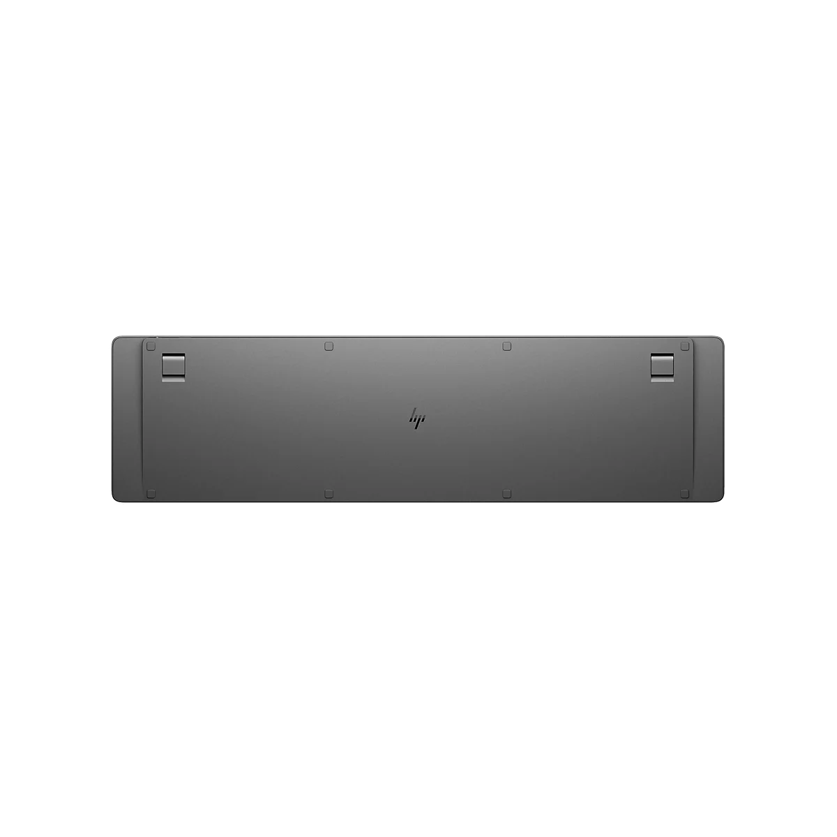 Rückseite einer grauen HP Tastatur mit ausklappbaren Standfüßen und rutschfesten Gummipads.