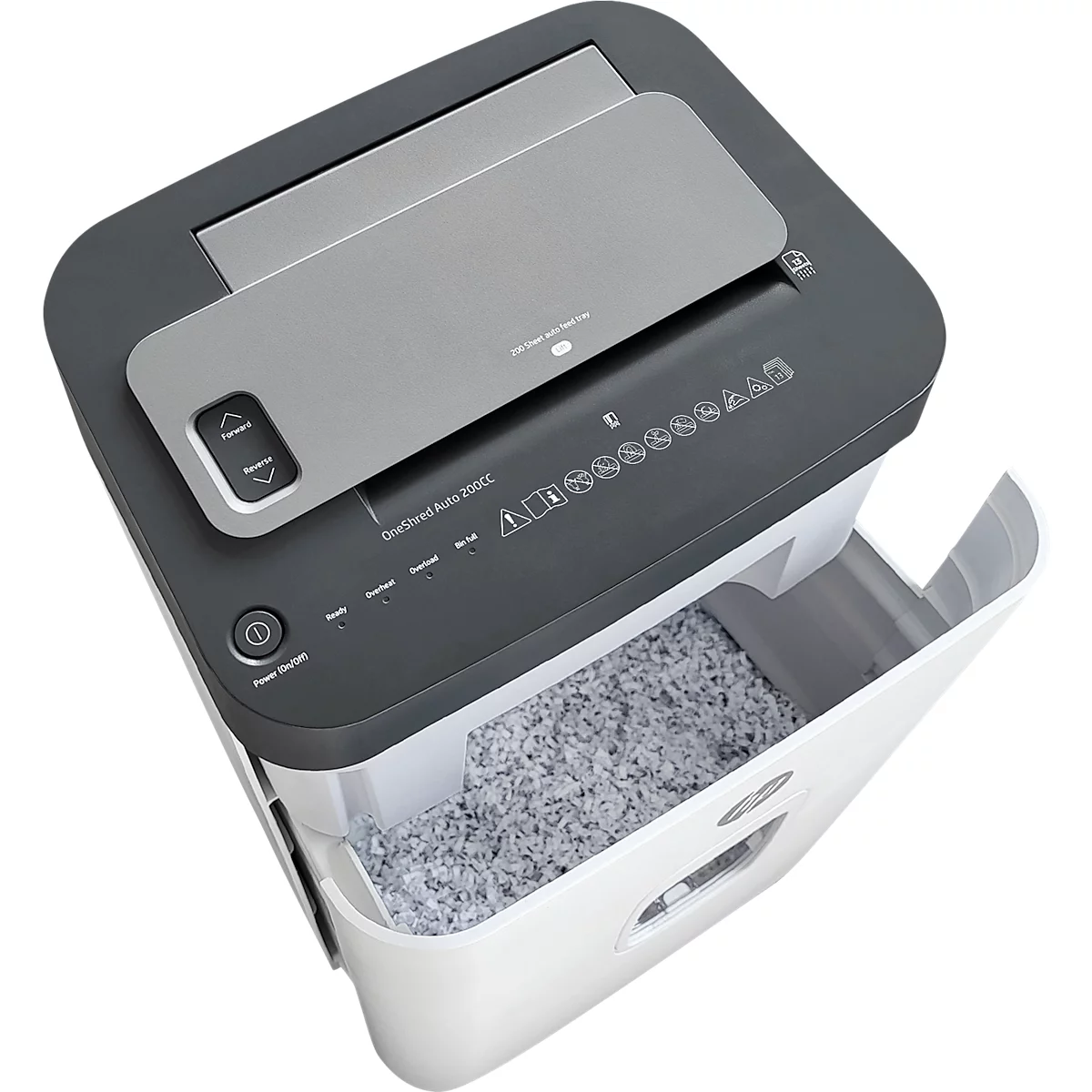 Shredder, gray and white, with open container. Control panel with arrows, shredded paper below.