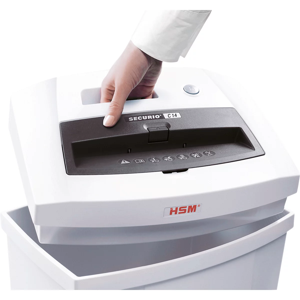 A hand lifts the top of a white paper shredder, with the collection bin below. The shredder says SECURIo C14.