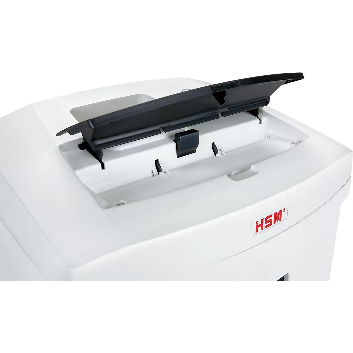 Close-up of a white paper shredder with an open black lid. Red lettering 'HSM'.