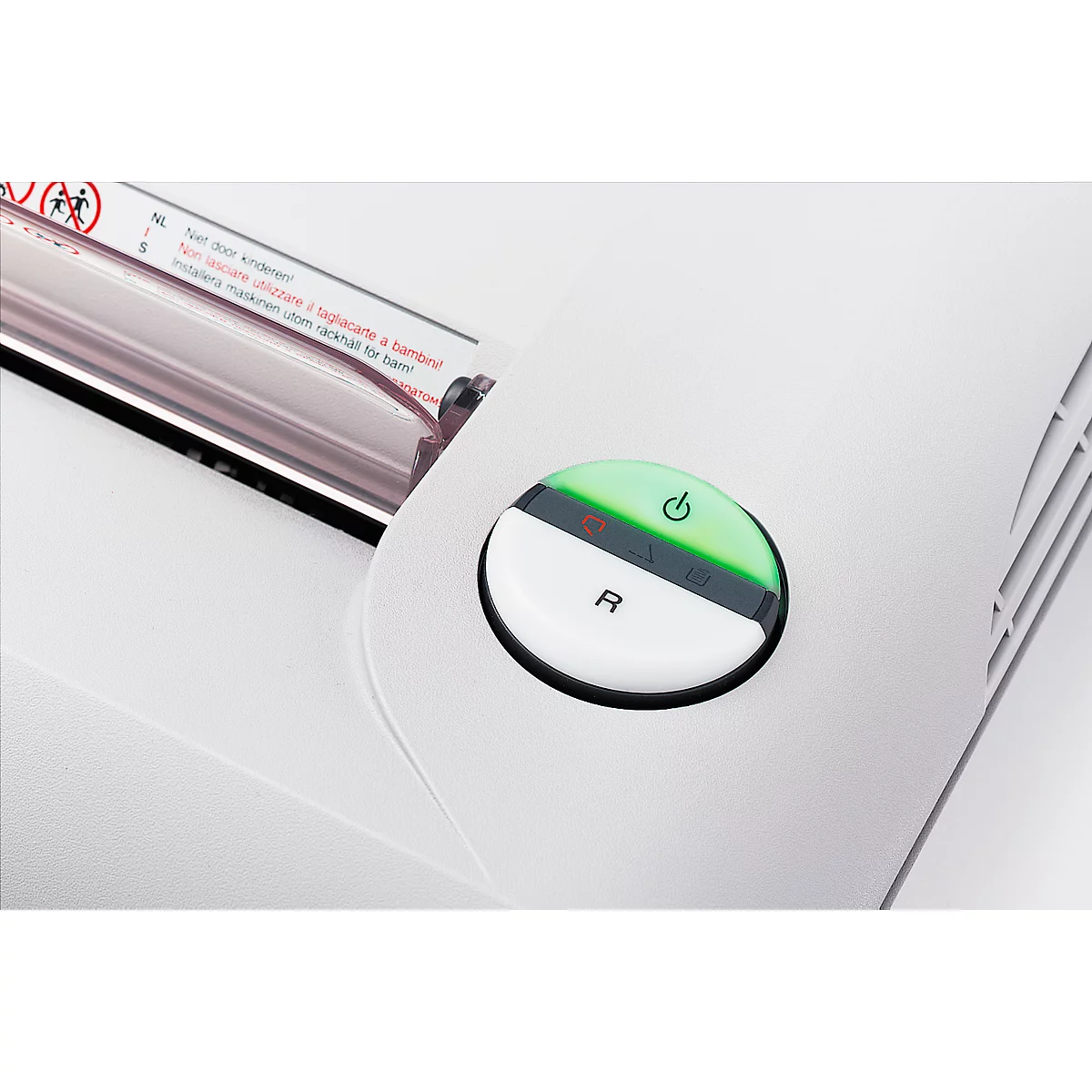 Close-up of a white paper shredder with highlighted on/off button. The button is bi-colored, green illuminated on top, white on bottom with 'R'.