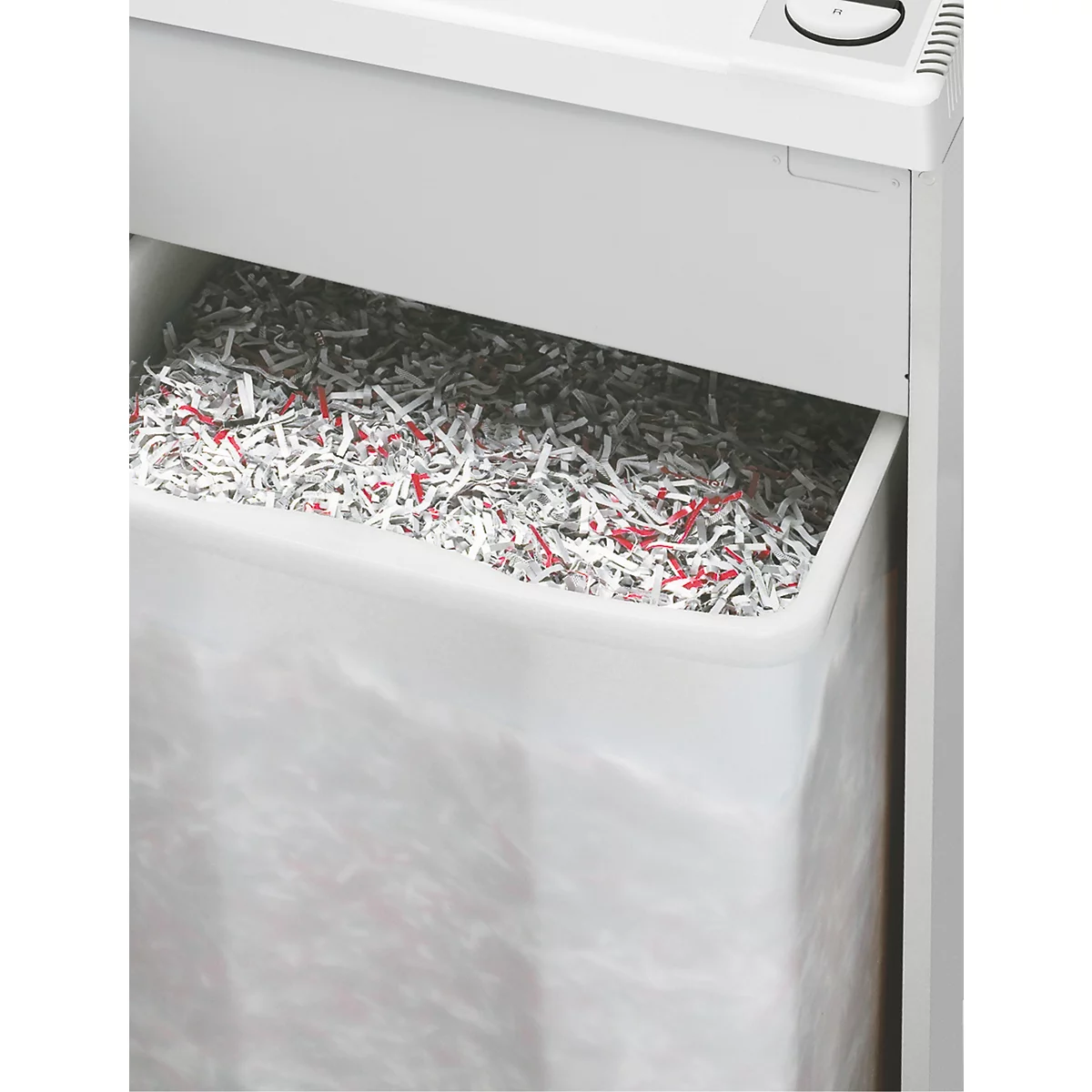 Nahaufnahme eines Aktenvernichters mit vollem Auffangbehälter, gefüllt mit geschreddertem Papier.