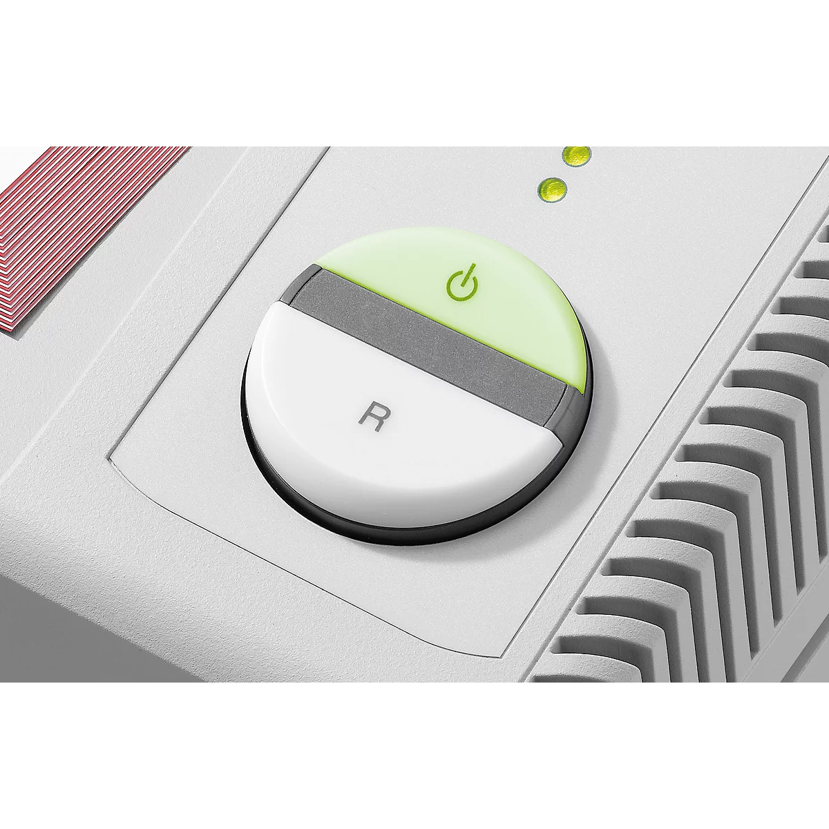 Round, divided button. Top half green with power symbol. Bottom half white with "R". Gray stripe. Two yellow lights.