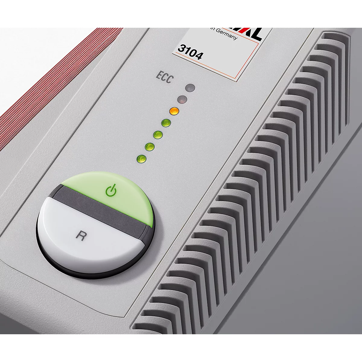 Gray device with green and yellow lights and a round button with the letters R and a green on/off symbol.