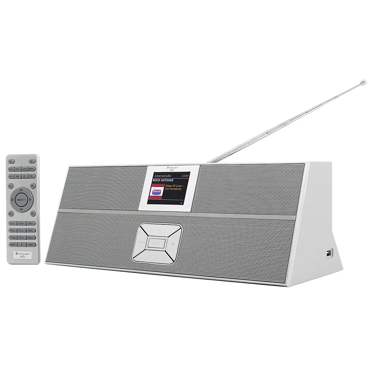 Gray radio with remote control. Antenna extended, display with text. Button below, remote control beside it.