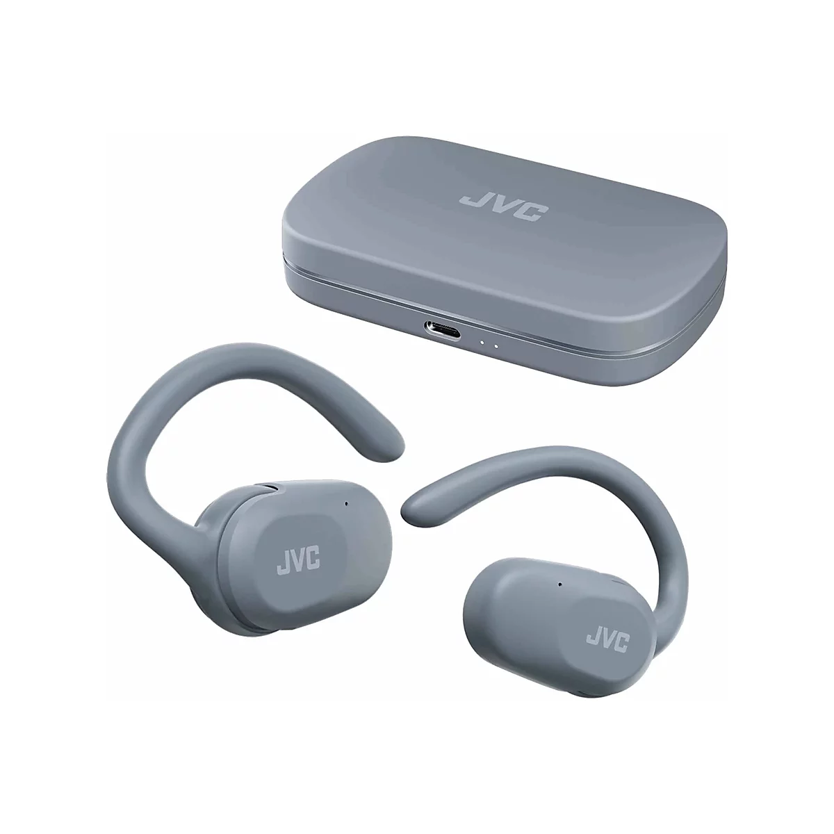 Graue JVC In-Ear-Kopfhörer mit Ohrbügeln und passendem Ladecase auf weißem Hintergrund.