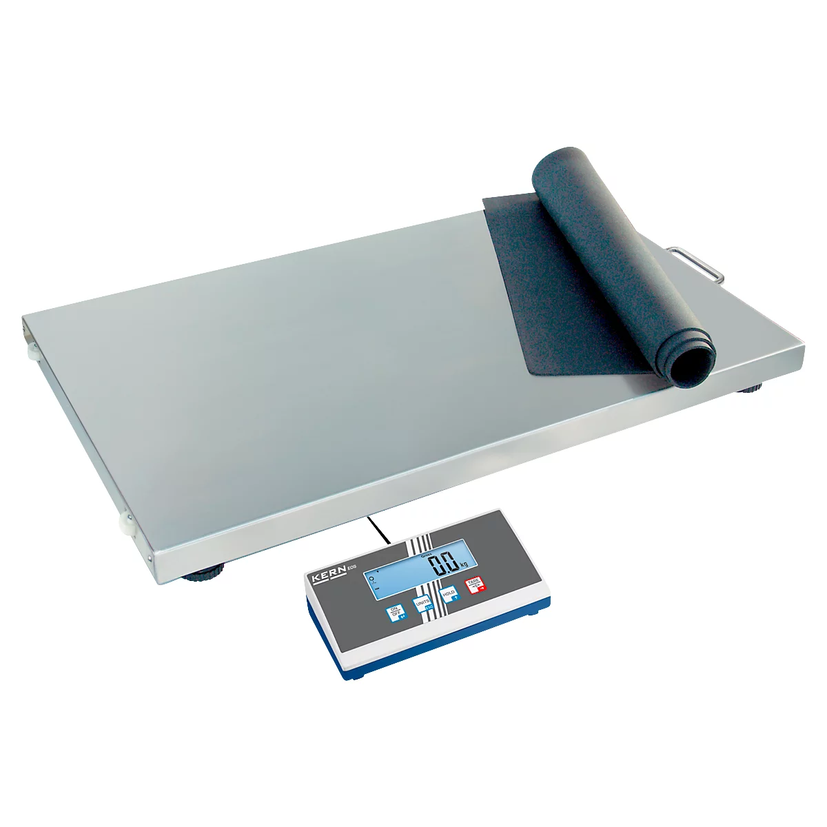 Balance avec écran, sur lequel se trouve un tapis noir enroulé. L'écran affiche 0,0.