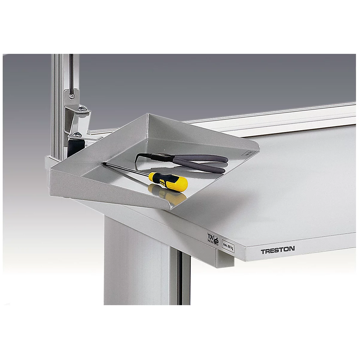 Metal shelf with tools on a workbench. It shows a screwdriver, pliers and the inscription Treston.