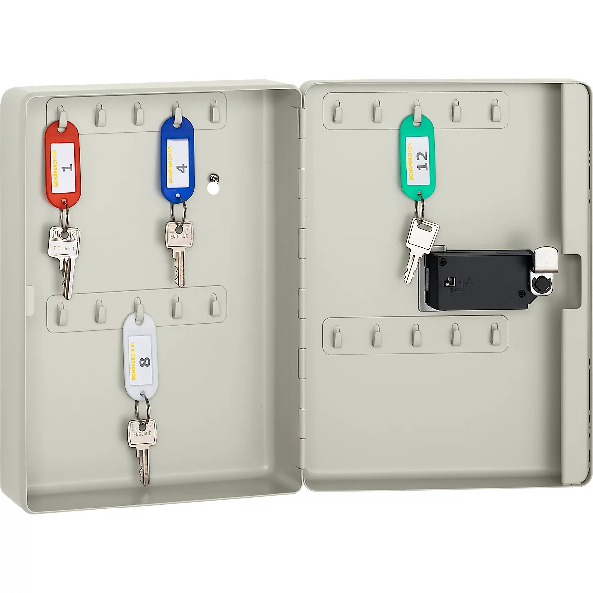 Opened key cabinet with keys. The key fobs are color-coded and numbered. A lock is also present.