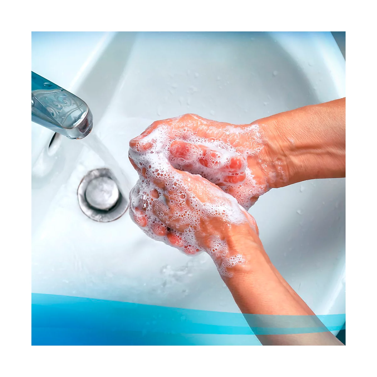 Hands being washed with soap under running water.
