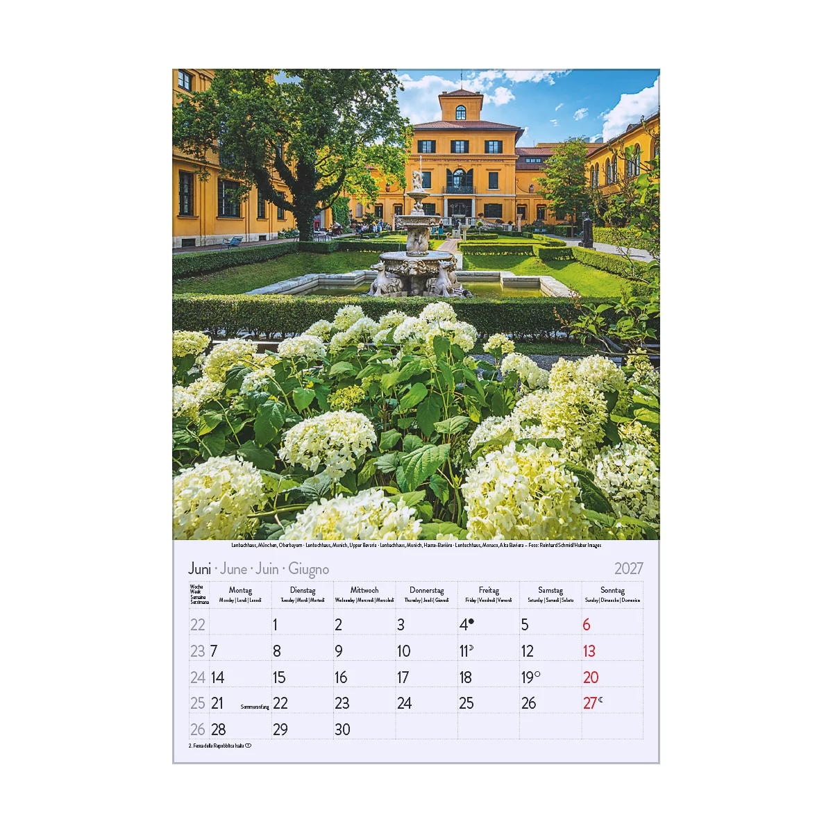 Calendrier montrant le mois de juin avec des fleurs, des bâtiments et une fontaine. L'année 2027 est visible sur le calendrier.