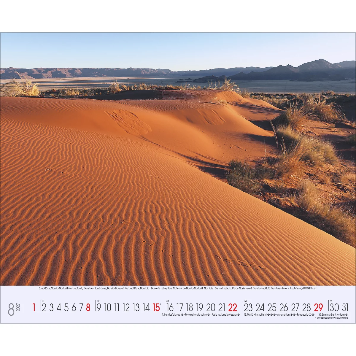 Paysage désertique aux couleurs chaudes et texturé. Montagnes en arrière-plan, calendrier au premier plan.