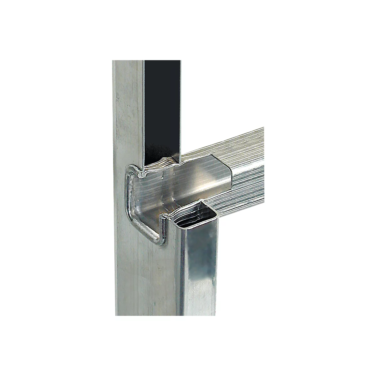 Detailed close-up of a metallic, angular construction connecting two tubes. Sharp edges and precise cutouts.