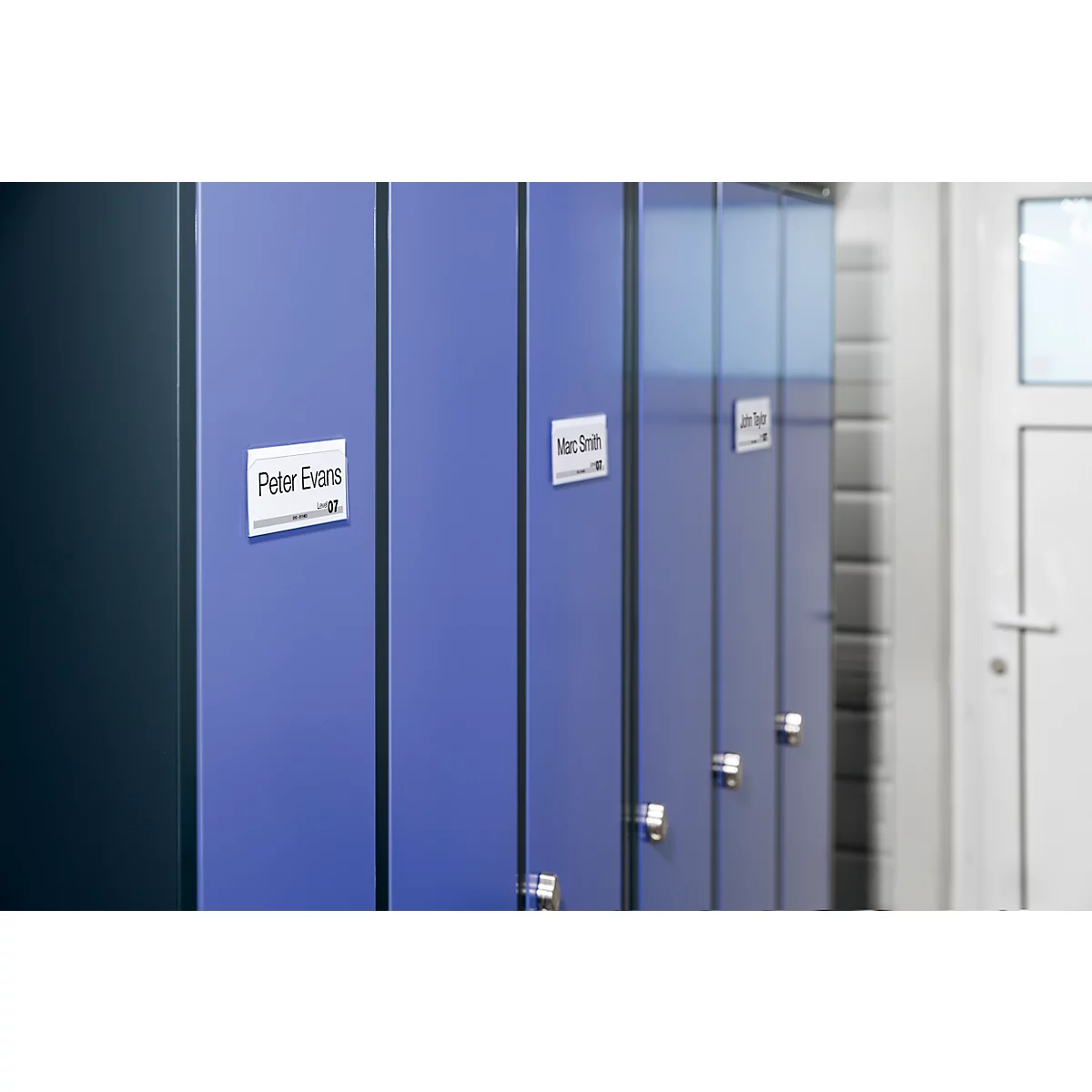 A row of blue lockers labeled with names. Peter Evans, Marc Smith, and Ian Evans.