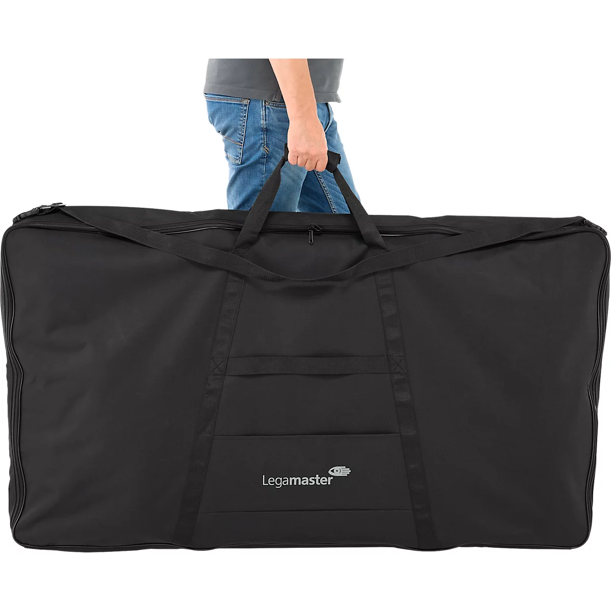 A person holds a large, black carrying bag with the "Legamaster" logo. The bag has handles and zippers.