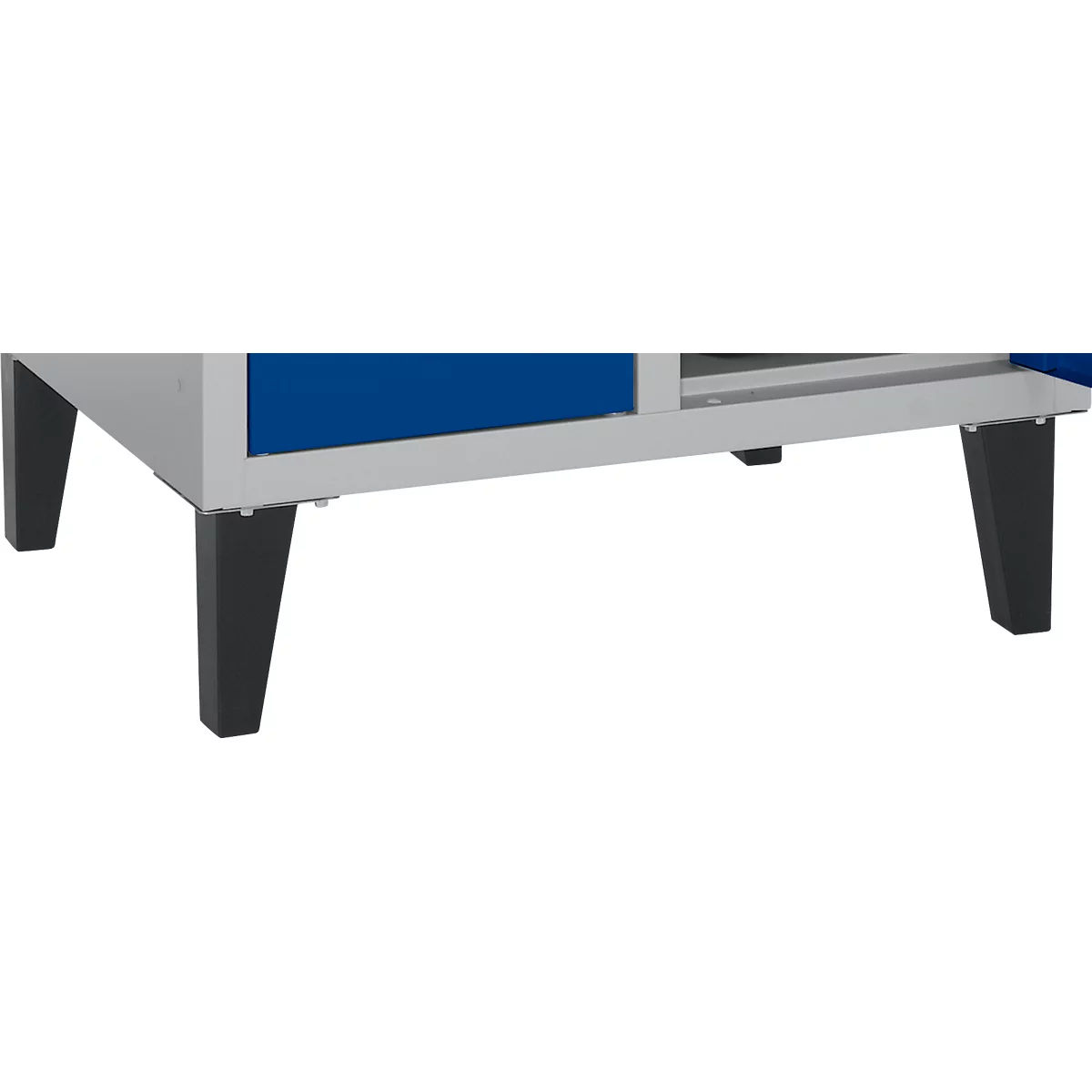 Close-up of black furniture legs on a white and blue cabinet.