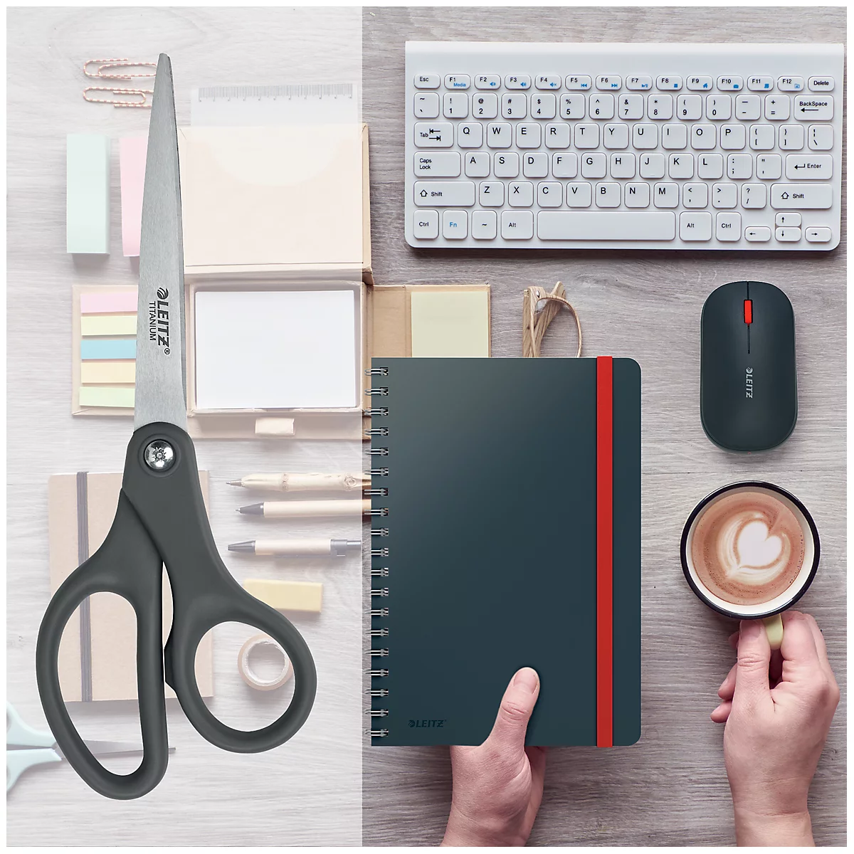Vue de dessus d'un bureau avec des ciseaux, un cahier, une souris, un clavier, du café.