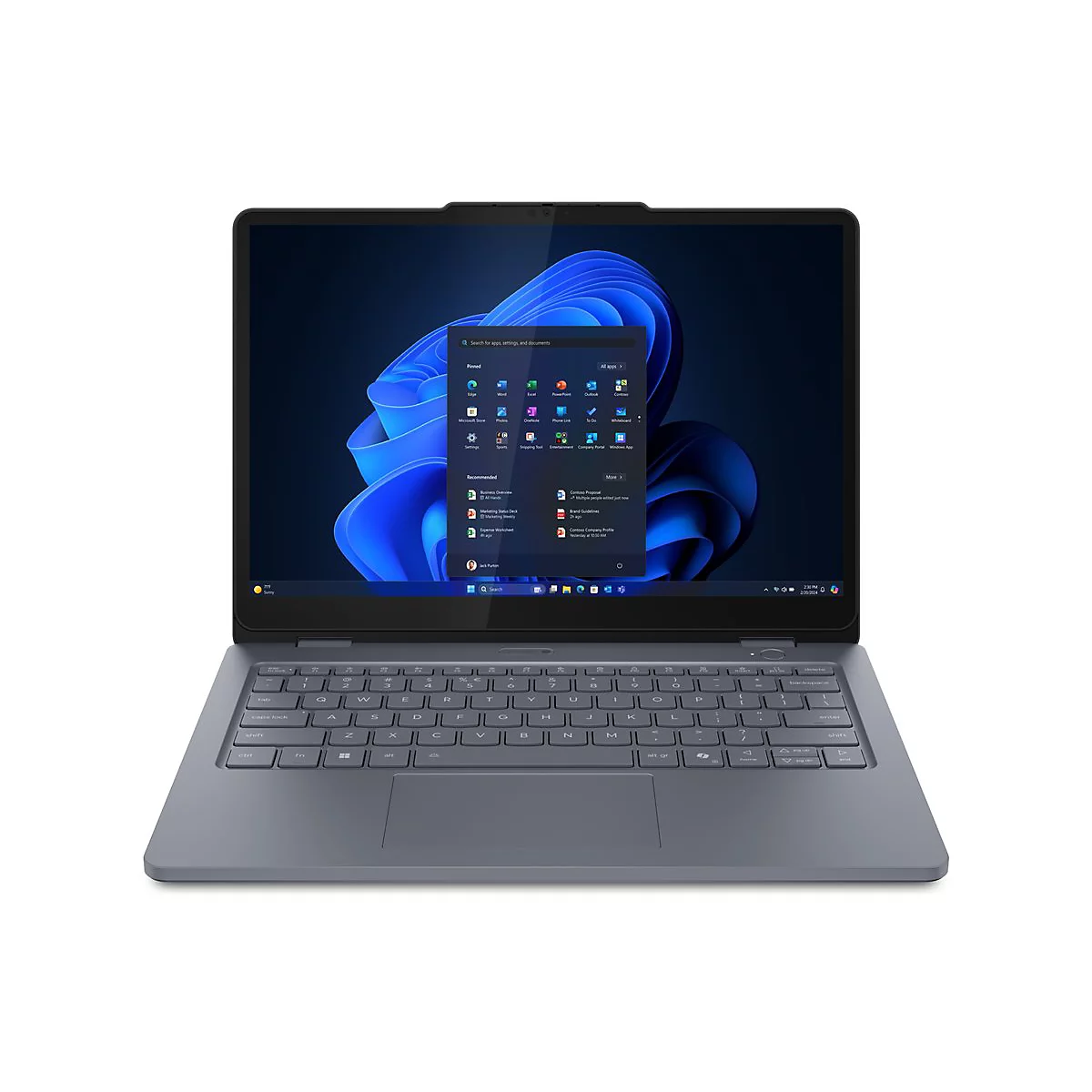 Ein grauer Laptop ist geöffnet, der Bildschirm zeigt das Windows 11 Startmenü. Auf dem Bildschirm sind Symbole und App-Optionen zu sehen.