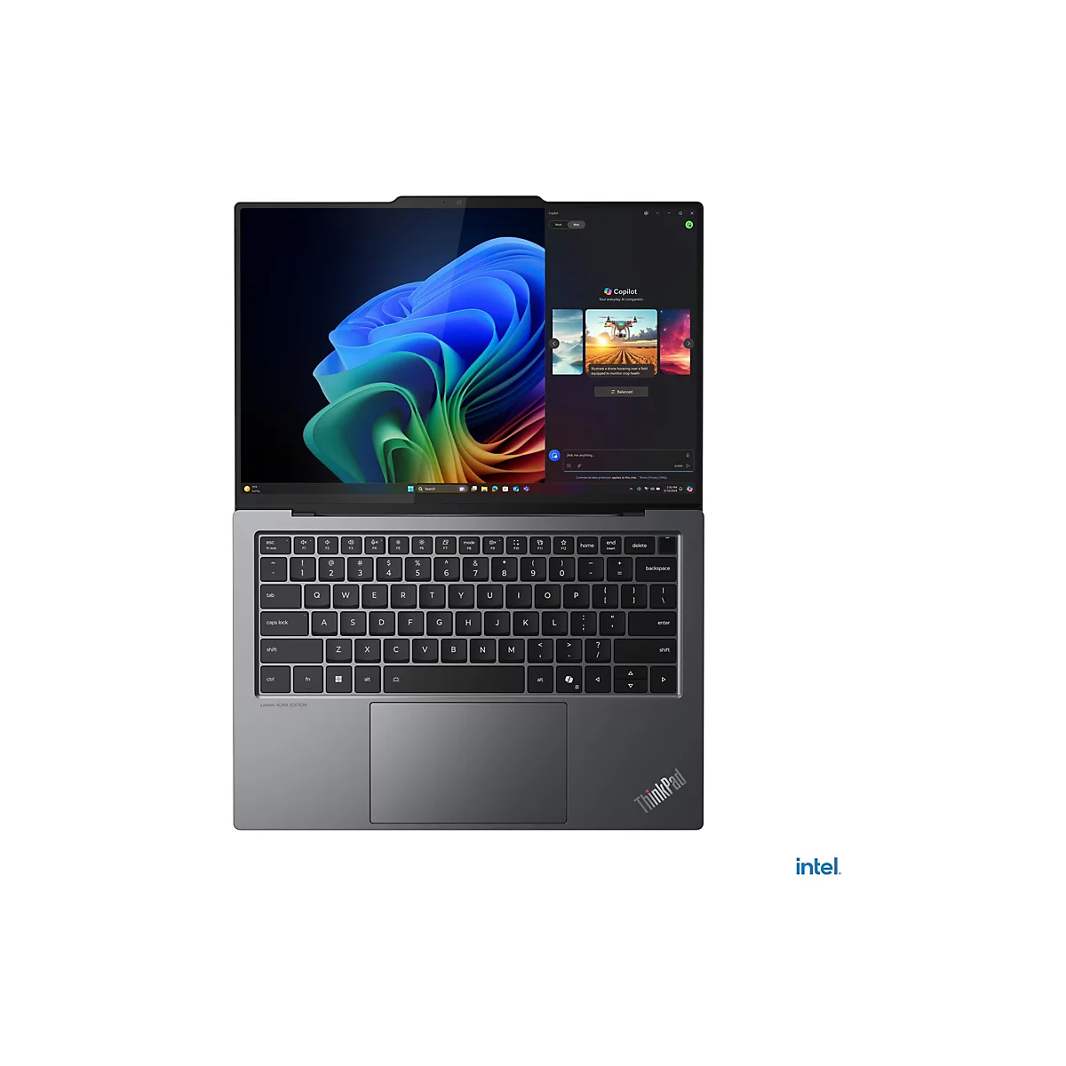 Draufsicht auf einen geÃ¶ffneten, grauen Laptop mit Tastatur, Touchpad und Bildschirm, der ein farbenfrohes Hintergrundbild zeigt.