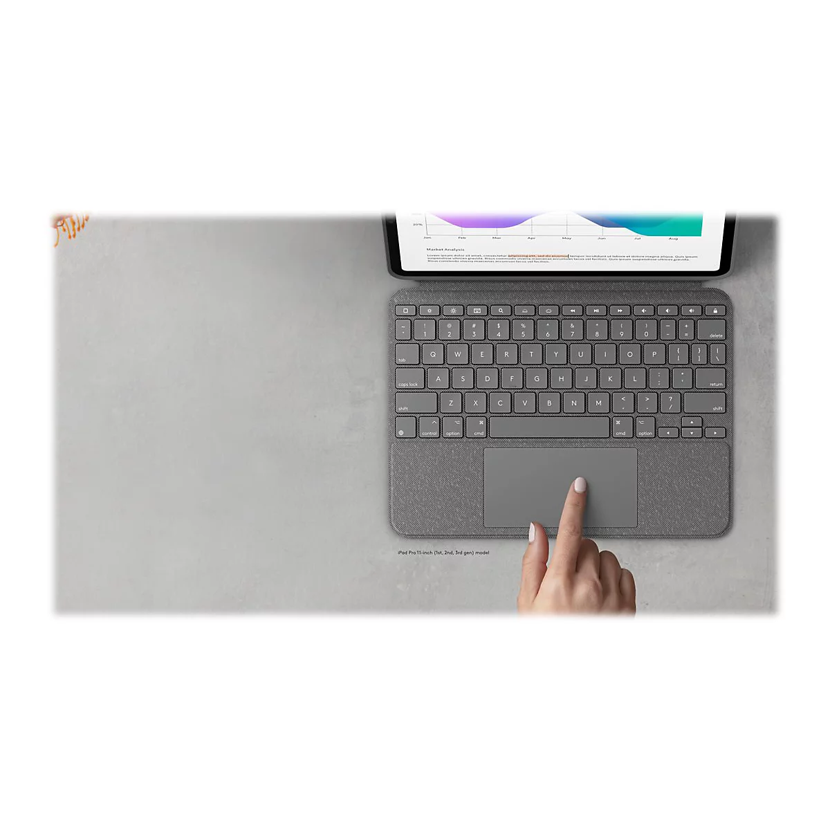Draufsicht auf graues Tablet mit Tastatur. Ein Finger berÃ¼hrt das Touchpad. Diagramm auf dem Bildschirm.