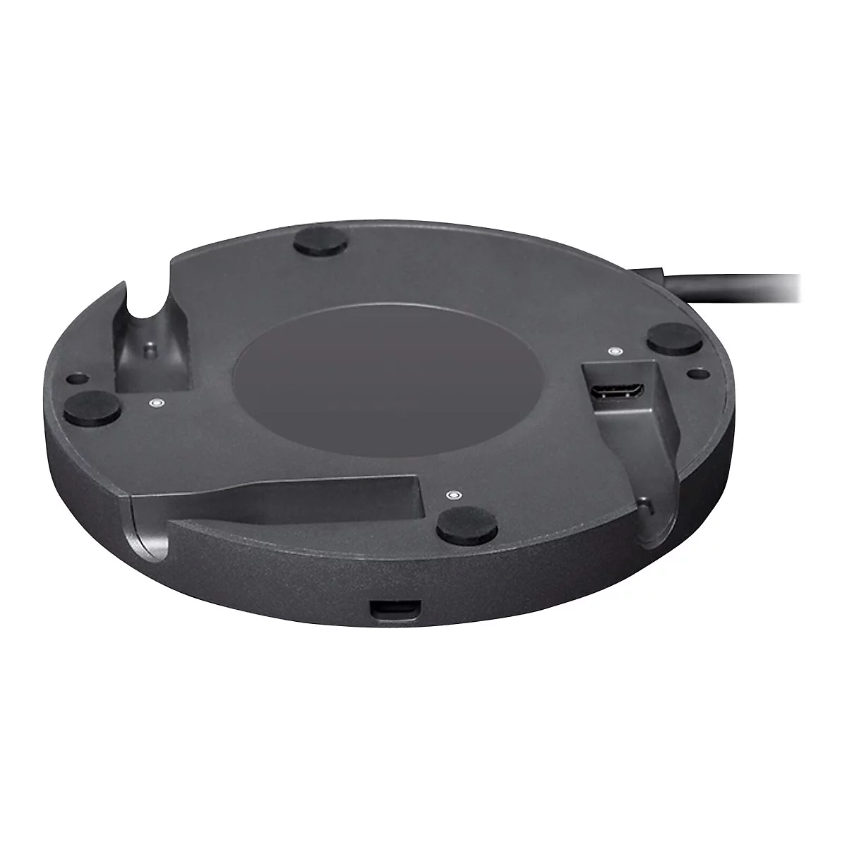 Schwarze, runde Basis mit Aussparungen und Anschlüssen, Ansicht von unten. Kleinere schwarze Füße und eine HDMI-Buchse sind erkennbar.