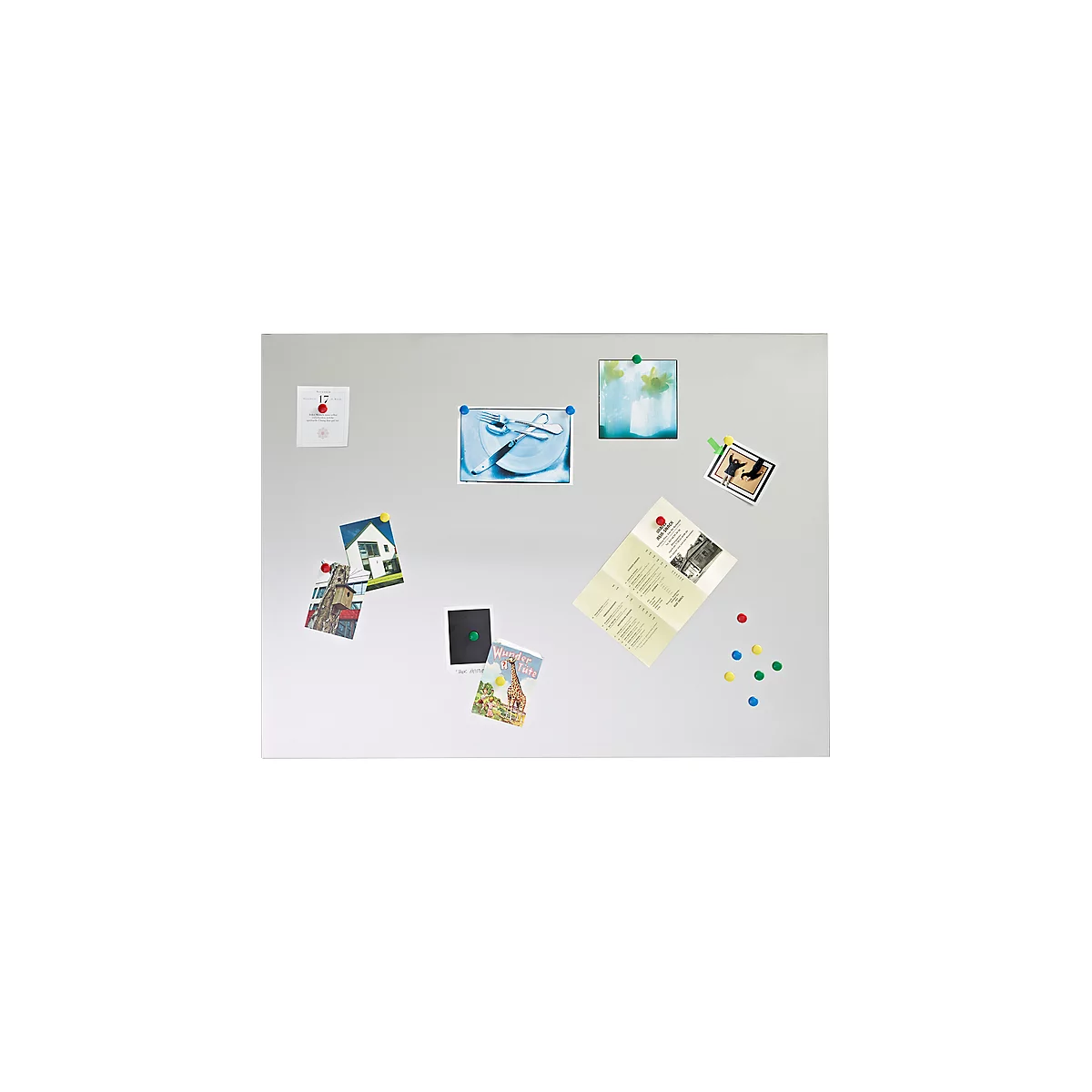 Gray magnetic board with pictures and notes, attached with colored magnets. A picture shows a plate with cutlery.