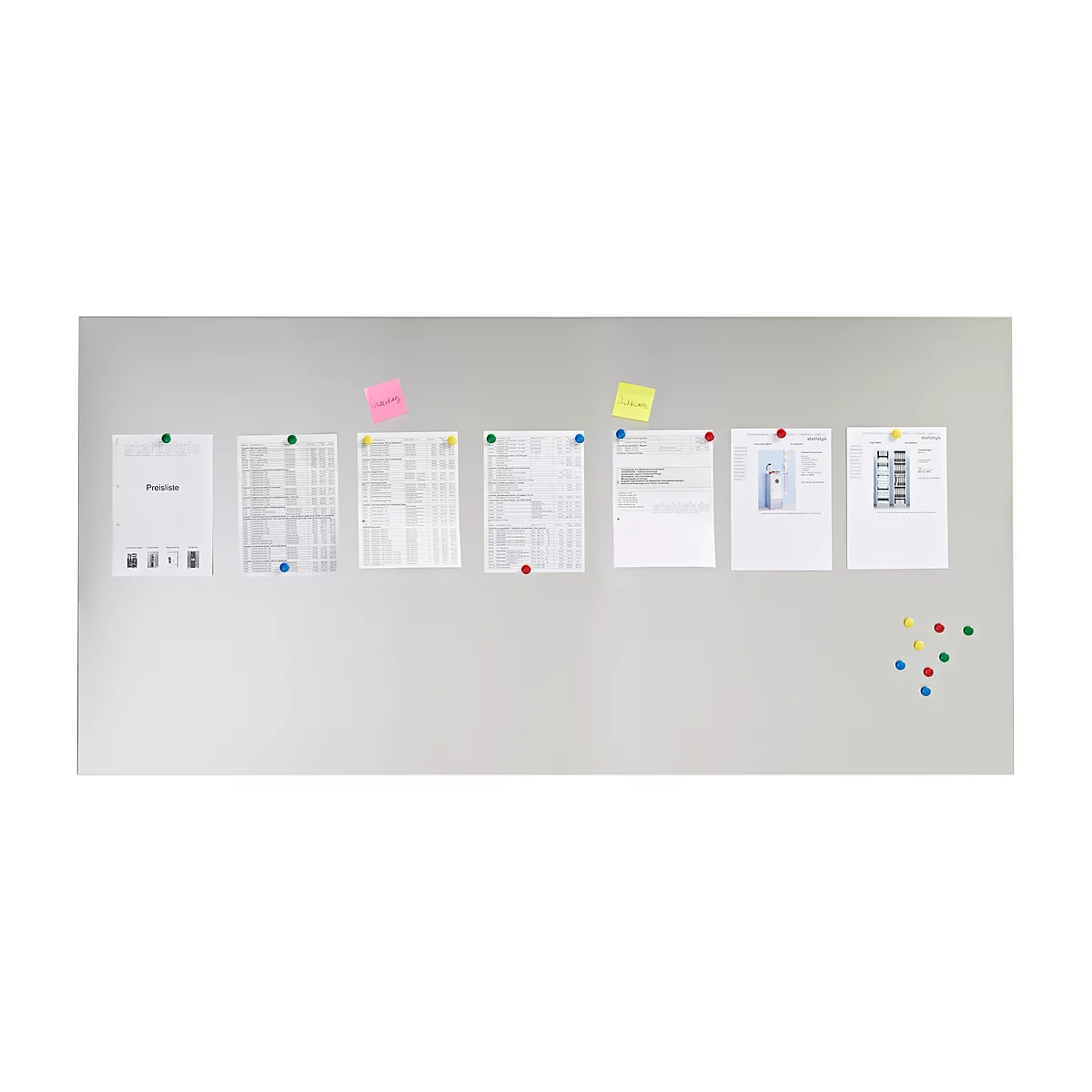 Gray wall with papers and notes. Papers and sticky notes with colorful thumbtacks attached to the wall.