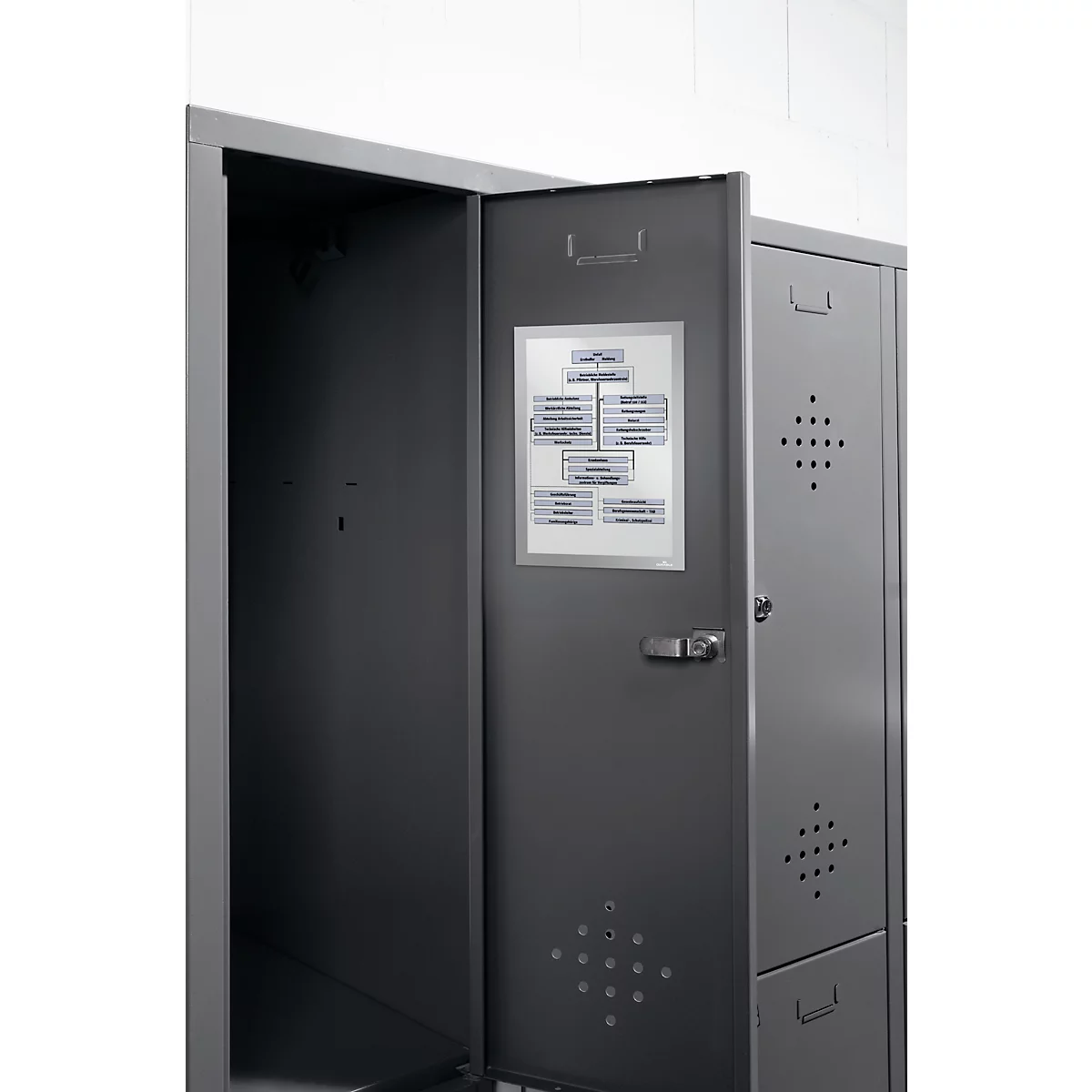 Gray cabinet, door open, with diagram. Behind it, an empty cabinet.