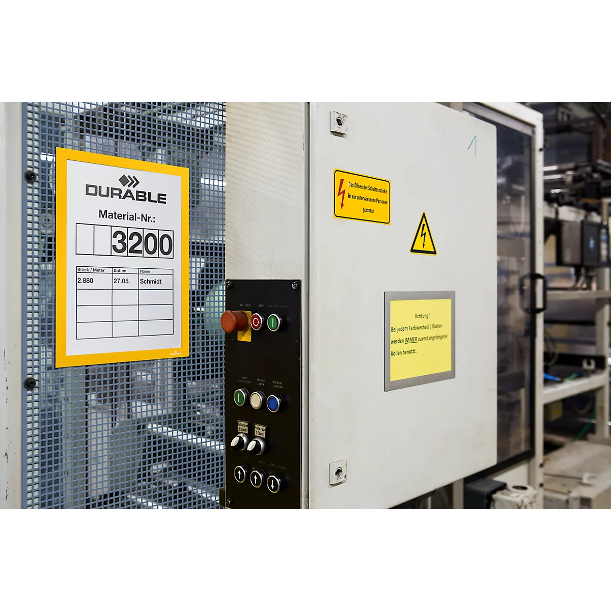 Machine detail with signs: 'DURABLE' with material number '3200', warning signs, and control buttons.