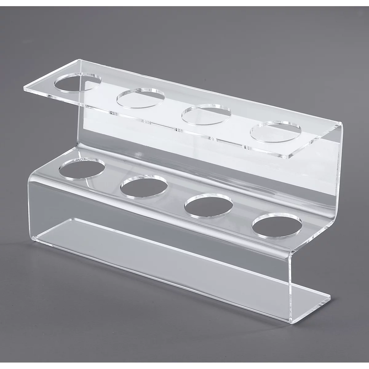 Transparent acrylic ice cream cup holder with holes to place cups. On a gray background.